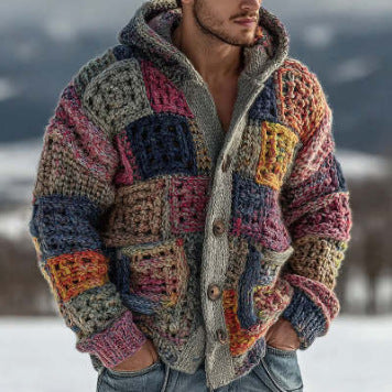 Person wearing a colorful crochet jacket in a snowy landscape