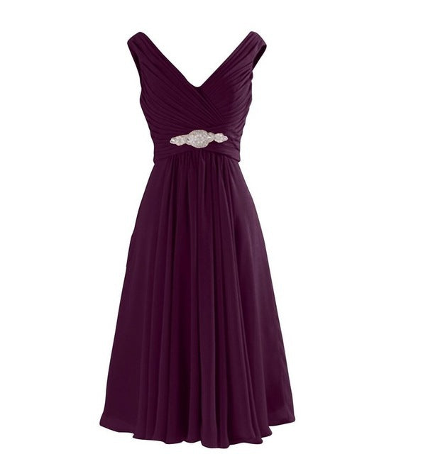 Purple dress with a belt on a white background