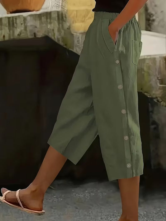 Person wearing green button-up skirt with blurred background
