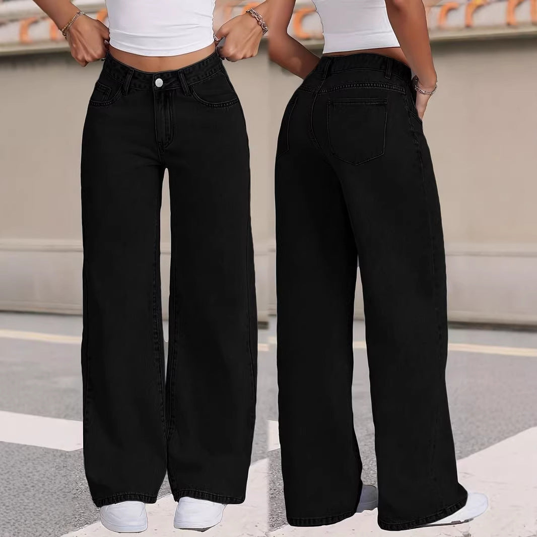 Two people wearing black wide-leg jeans and white tops on a street.