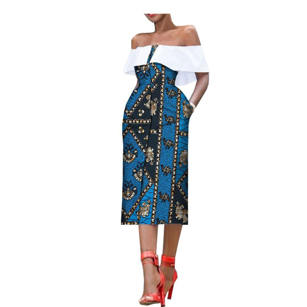 Woman wearing a blue and black patterned off-shoulder top with a white outfit underneath on a white background.