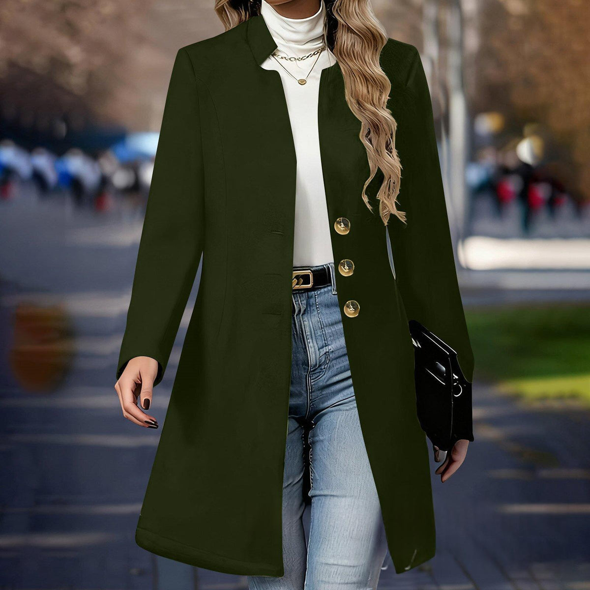Person wearing a green coat with gold buttons in an urban setting